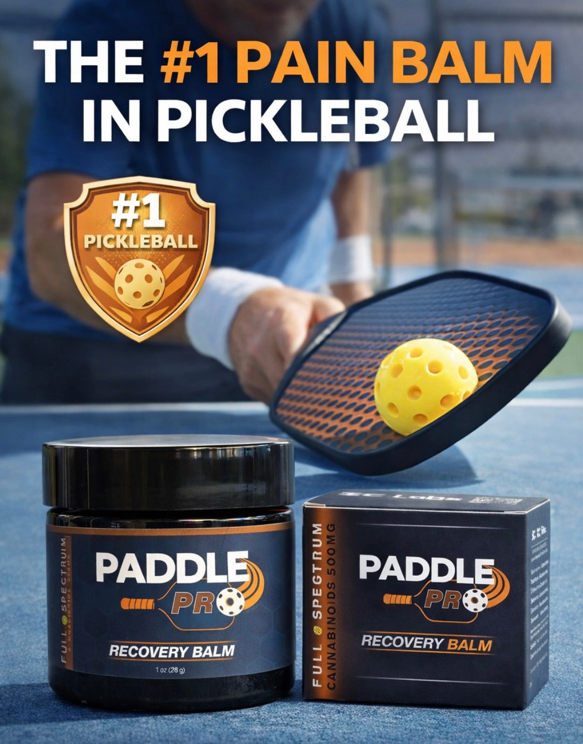 Paddle Pro Recovery Balm on a pickleball court next to a paddle and ball.